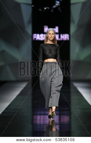 ZAGREB, CROATIA - OCTOBER 17: Fashion model wearing clothes designed by Petra Vuletic and Sasa Hortig on the 'Fashion.hr' show on October 17, 2013 in Zagreb, Croatia.