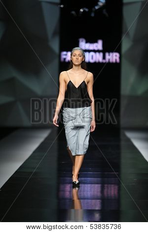 ZAGREB, CROATIA - OCTOBER 17: Fashion model wearing clothes designed by Petra Vuletic and Sasa Hortig on the 'Fashion.hr' show on October 17, 2013 in Zagreb, Croatia.