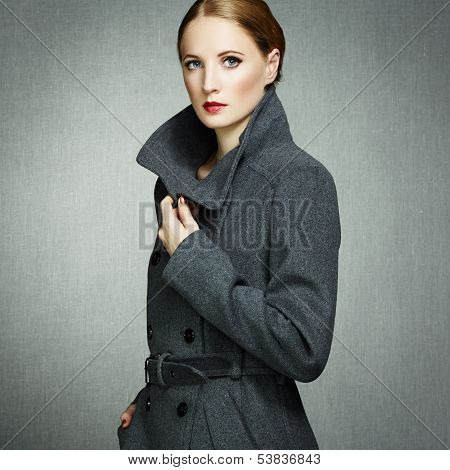 Portrait Of Young Woman In Autumn Coat