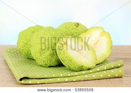 Osage Orange fruits (Maclura pomifera), on wooden table