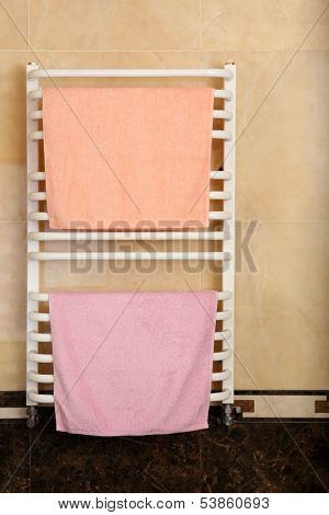 Color towels on radiator in bathroom