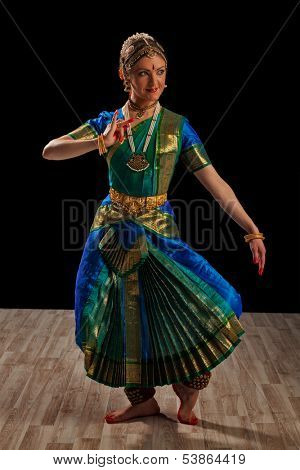 Young beautiful woman dancer exponent of Indian classical dance Bharatanatyam