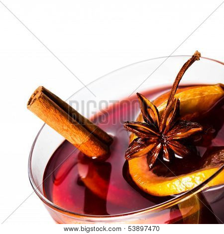 Hot Red Mulled Wine For Christmas  And Winter With Orange Slice, Anise And Cinnamon Sticks Isolated