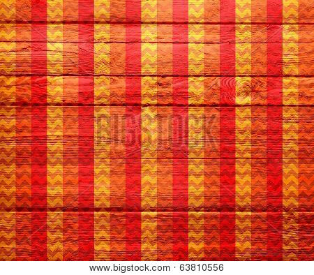 Colorful chevron pattern on wood texture background