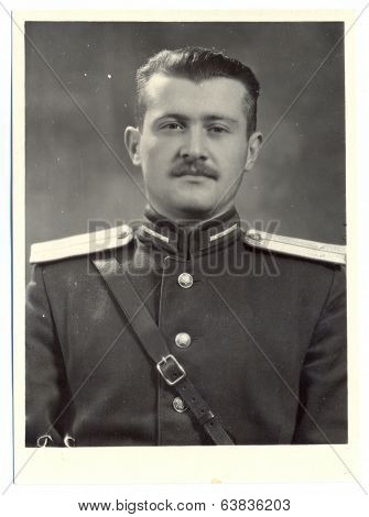antique photo shows portrait of a Soviet Army lieutenant in uniform
