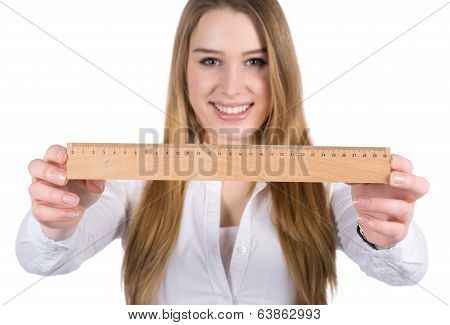 Young Woman Shows A Ruler