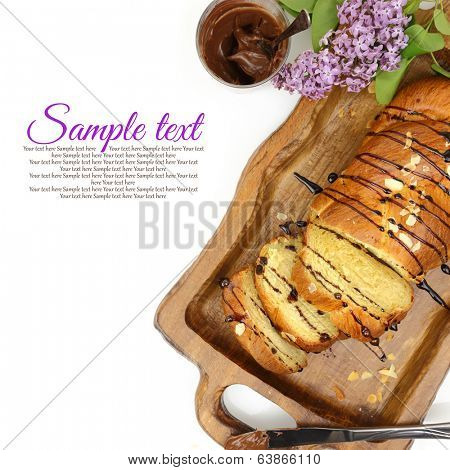 Sweet brioche bread on tray with chocolate spread
