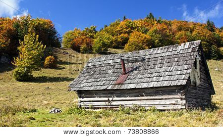 Woody Chalet On The Mountains With Sky And Clouds