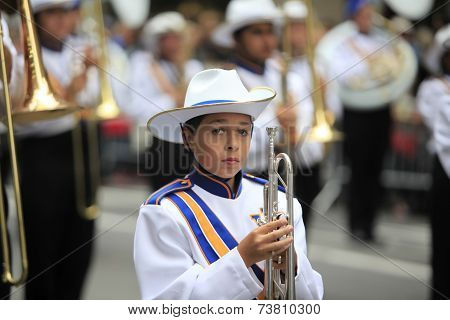 Marching band member with silver horn