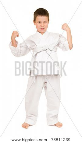 boy in white kimono for martial arts posing