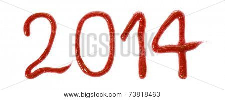 Year 2014 written with a red glittering colour paste.