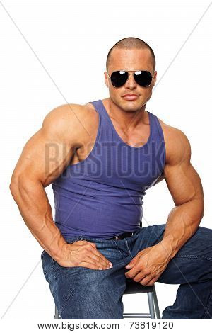 Muscular man on chair