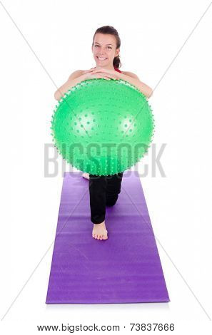 Young woman exercising with swiss ball