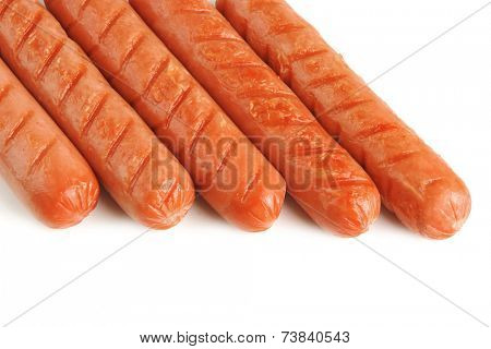 row of grilled beef sausages on white