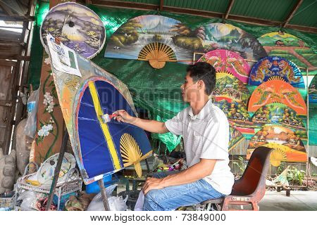 An Unidentified Man Make Paper Umbrella
