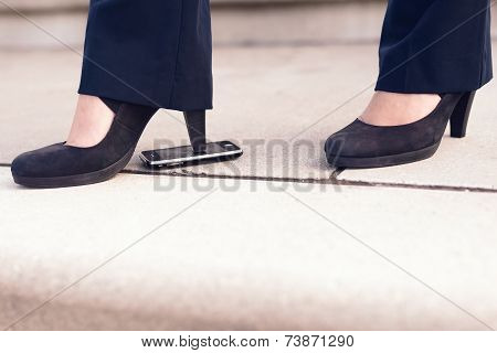Woman In Black Heel Shoes Step On Phone