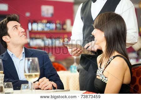 Couple ordering food in a restaurant