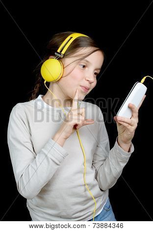 A Beautiful Young Girl Listening To Music With A Walkman