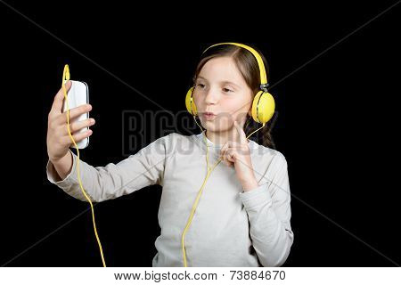 A Beautiful Young Girl Listening To Music With A Walkman