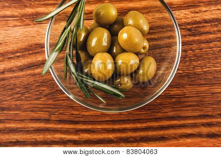 Olive oil and olives in bowl