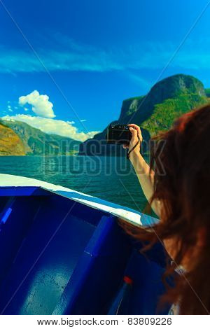 Tourism. Woman With Camera On Ship, Fjord In Norway.