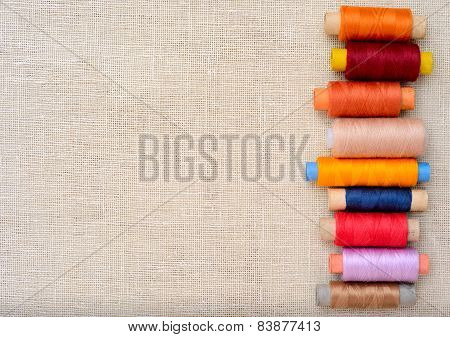 Copyspace image with sewing threads on linen