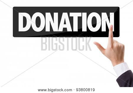 Businessman pressing button with the text: Donation