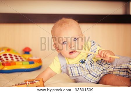 Small Kid Playing With Drum Stick