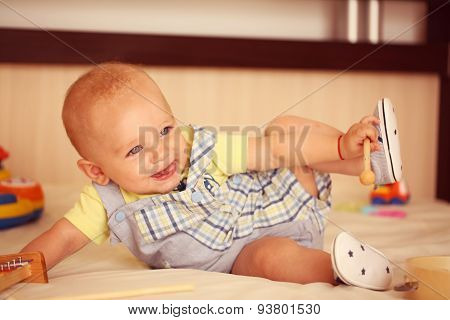 Small Kid Playing With Drum Stick