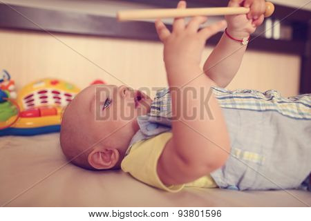 Small Kid Playing With Drum Stick