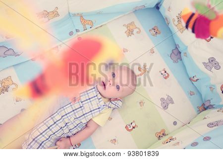 Playful Kid In His Bed