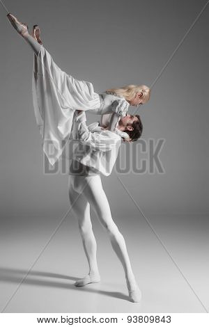 Two young ballet dancers practicing. attractive dancing performers  in white