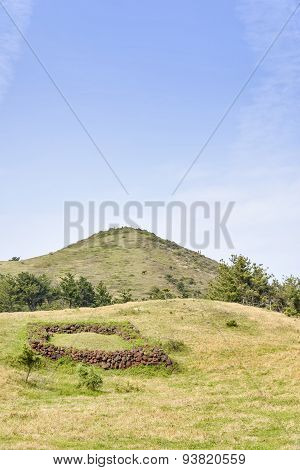 Landscape Of Songaksan Mountain With Jeju Traditional Tomb