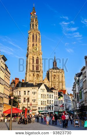 ANTWERP BELGIUM - 10 AUGUST 2014: Tourists visiting Grote Markt and Cathedral of Our lady in Antwerp Belgium. The church is the largest gothic in Benelux built in 1352 in Flanders.