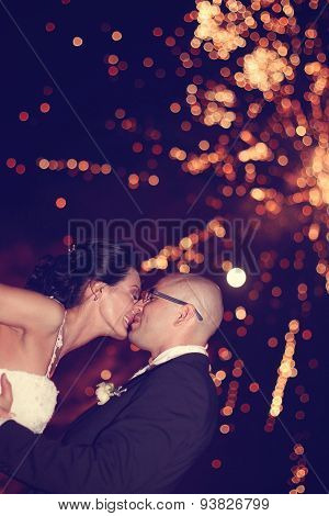Bride And Groom Surrounded By Fire Crackers