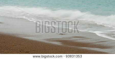 Seashore Waves With Sandy Beach  Background