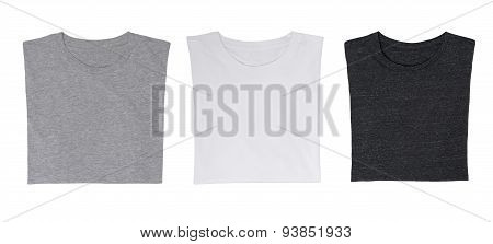 Close-up Of The Three T-shirts (black, White And Grey). Isolated.