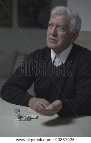 Senior Man Taking Medicament