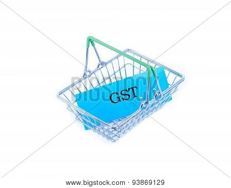 GST word on blue paper inside basket on white background