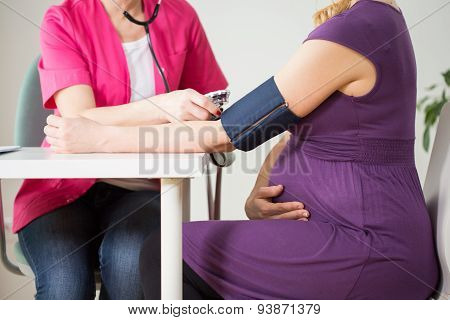 Doctor Measuring Pressure