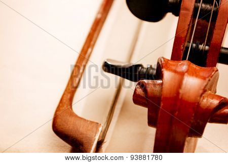 Close Up Of Violin Scroll And Bow