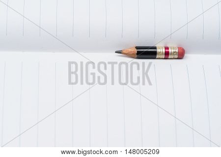 Black Pencil With Pink Eraser On A Paper