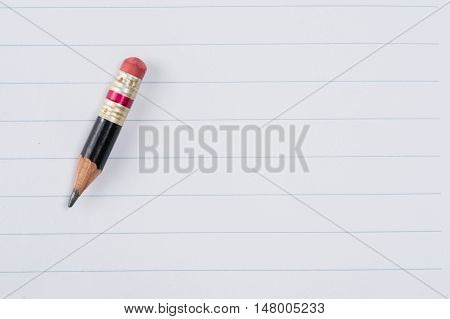 Black Pencil With Pink Eraser On A Paper