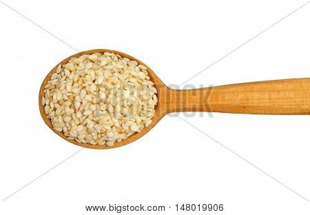 Sesame seeds on wooden spoon isolated on white background