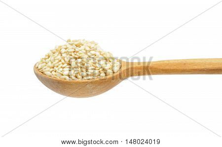 Sesame seeds on wooden spoon isolated on white background