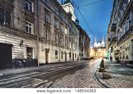 Stone-paved street in old town leading to center