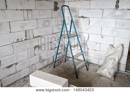 Stepladder in the corner during capital repair
