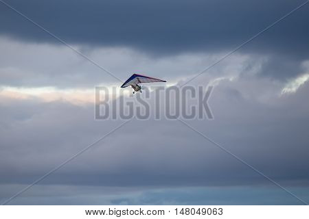 trike on a background of clouds in the evening sky