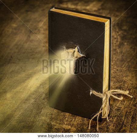 Magic Book closed on the rope emits light