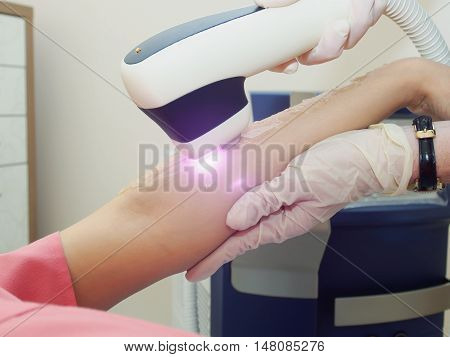 Laser Hair Arm Removal Epilation. Treatment In Cosmetic Salon.